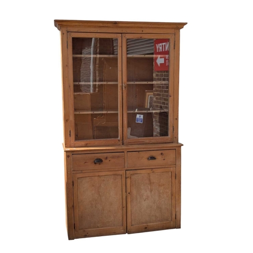 A 19th century Victorian country pine dresser. The glass boo...