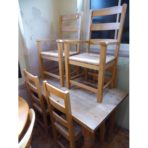 Pine kitchen table and 6 ladderback rush seated chairs