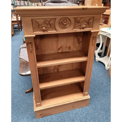 PINE OPEN BOOKCASE WITH CARVED DECORATION ON PLINTH BASE, 11...