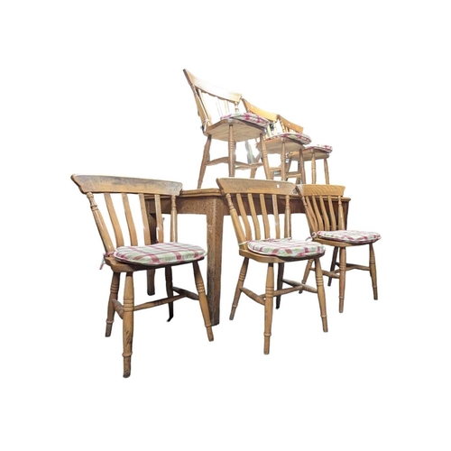 A large 20th century oak kitchen dining table and matching s...