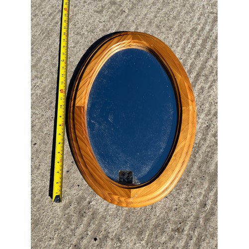 Oval pine framed mirror.