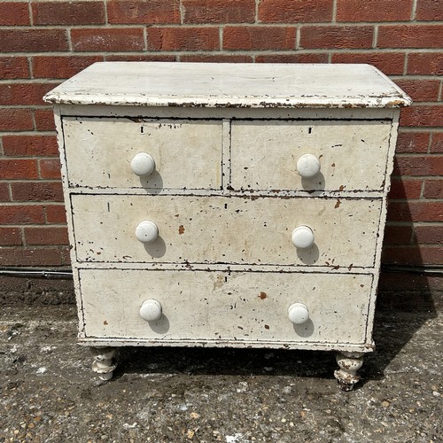 A vintage white painted pine chest of two short and two long...