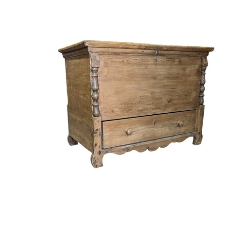 A 19th century Victorian pine mule chest. Raised on block fe...
